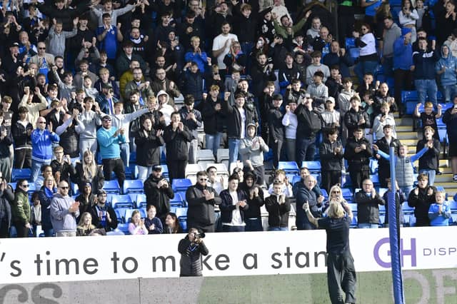 Posh Robbie Savage in front of the Posh fans in the GH Display stand. Photo David Lowndes.