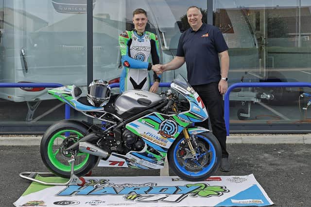 Max Hardy with Barry McGuinness, the manager of sponsor Pioneer Caravans in Eye.
