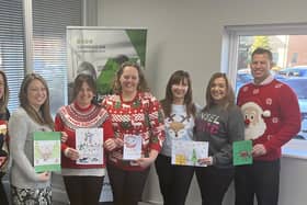 The Anne Corder Recruitment team with some of the festive designs received