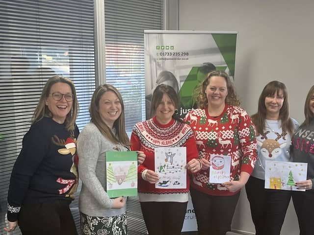 The Anne Corder Recruitment team with some of the festive designs received
