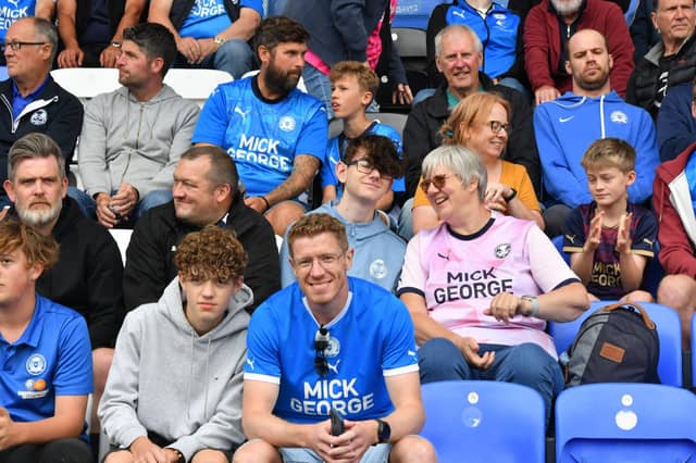 Peterborough United fans watch as their side are beaten at home to Wrexham.
