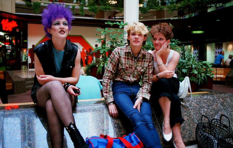 Three youngsters sitting inside Queensgate shortly after it opened