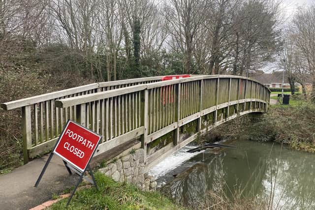 Some of the signage used to highlight the closure of three bridges at Cuckoos Hollow in Peterborough. Councillors say some of the signage and barriers have been thrown into the water.