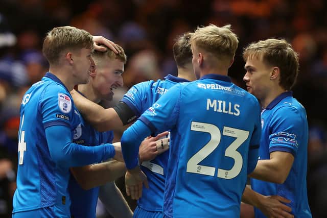 Posh celebrate the early goal from Ben Woods against Stockport County. Photo Joe Dent/theposh.com.
