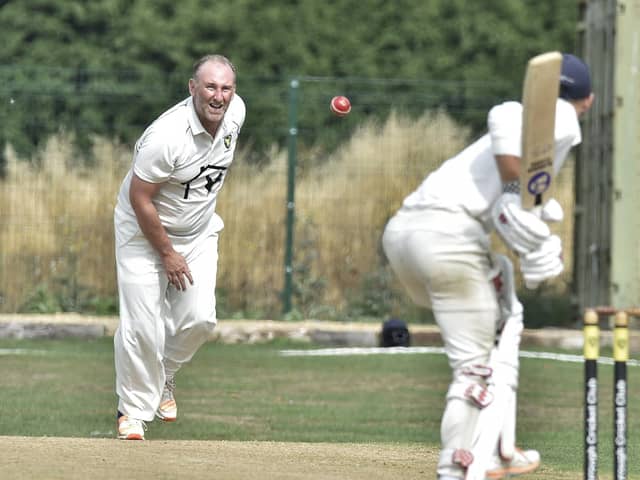 Nick Lawton bowling for Newborough against Heckington. Photo: David Lowndes.