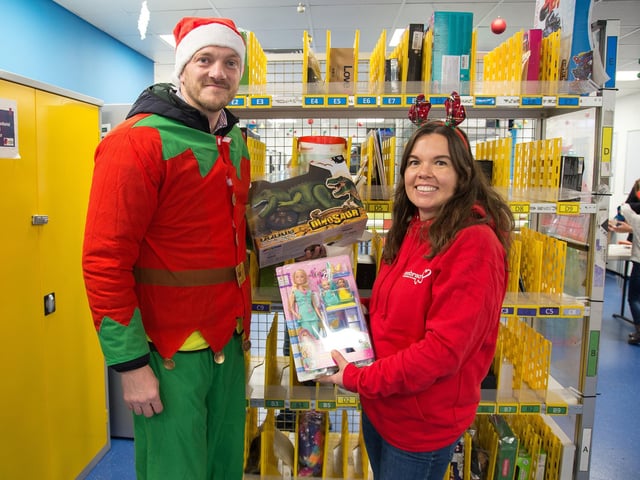 Amazon site manager Gareth Davies with Rachael Thornton from Embrace Child Victims of Crime