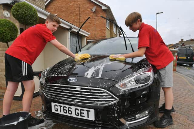 14-year-old Whittlesey car washers Tom Tilley and Tom Dunkley have become famous in Whittlesey for their business success.