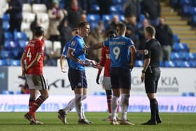 Josh Knight argues with referee Andrew Kitchen after his sending off against Charlton Athletic on Tuesday. Photo: Joe Dent.