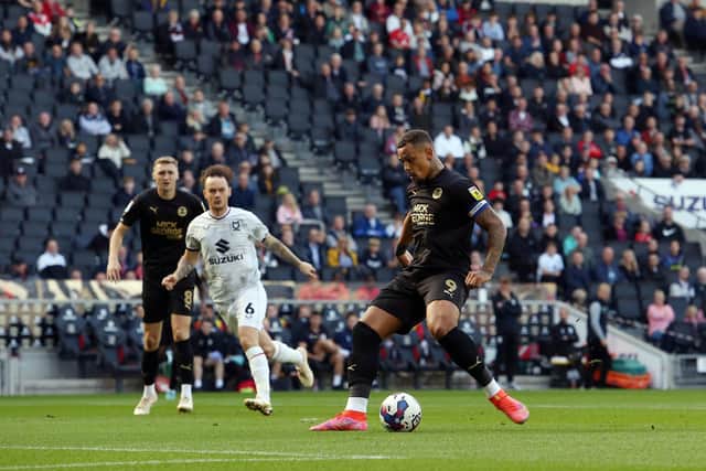 Jonson Clarke-Harris opens the scoring for Posh at MK Dons. Photo: Joe Dent/theposh.com.
