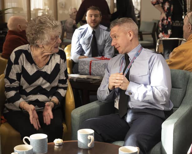Flt Lt Dean McAulay chats with residents of Kingfisher Court in Peterborough.
