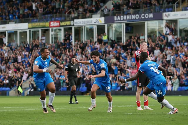 Joel Randall (centre) has just scored for Posh v Lincoln. Photo: Joe Dent/theposh.com.