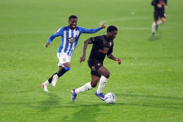 Bolu Shofowoke in action for Peterborough United against Huddersfield Town. Photo: Joe Dent.