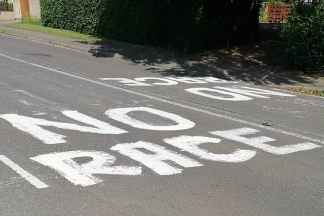 The writing on the road appeared overnight