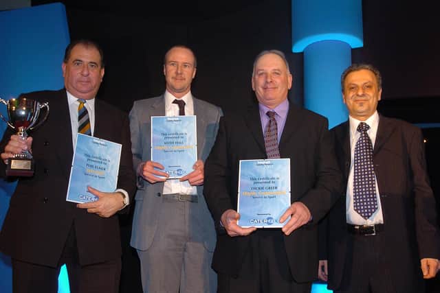 Richard Greer (second right) receiving a services to sport award from the PT,