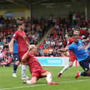 Jonson Clarke-Harris of Peterborough United scores the winning goal at Cheltenham. Photo: Joe Dent/theposh.com