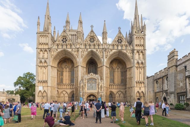 Guests enjoy the graduation ceremony in the grounds of Peterborough Cathedral
