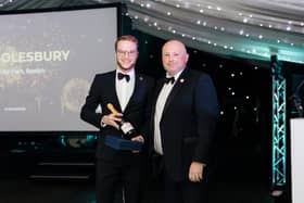 Dominic Solesbury receives his Support Person of the Year Award from Mark Chapman,  the Group Regional Operations Manager of the Coaching Inn Group.