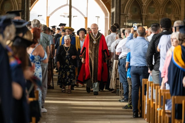 The Mayor of Peterborough Councillor Cllr Nick Sandford and Mayoress Cllr Bella Saltmarsh lead the degree procession at Peterborough Cathedral.
