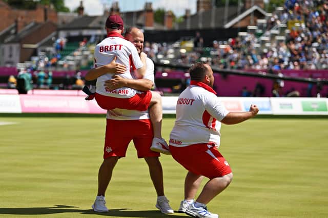Nick Brett celebrating with his England bowls teammates