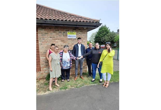 Community Centre leader Evelyn Speechley hands over the cheque to Gemma Wells from Gemma's Hearts, also in attendance, Cllr Sam Hemraj (left), Shabina Qayyum (right) and representatives from Britannia Fire and Security Ltd.