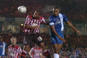 Tyrone Barnett (right) in action for Posh. Photo: David Lowndes.