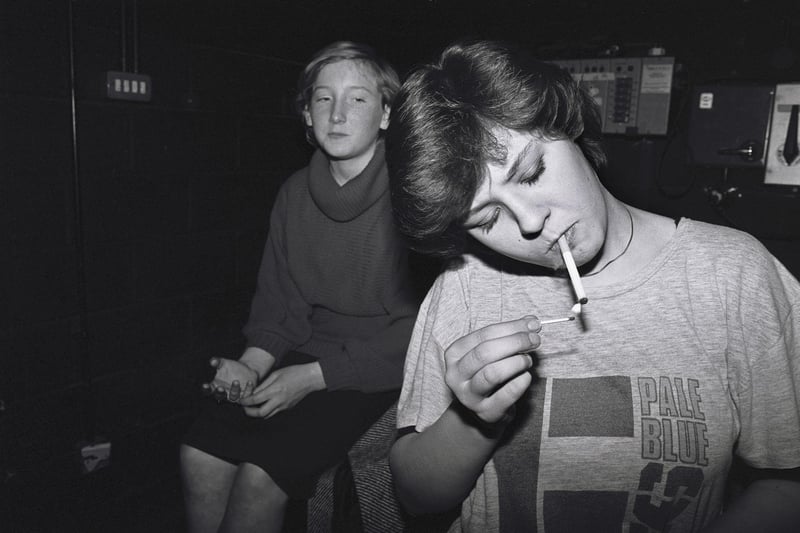 A girl lights a cigarette during a break in rehearsals at the Young People's Theatre Company at Bretton-Woods school in Peterborough, 1985.
