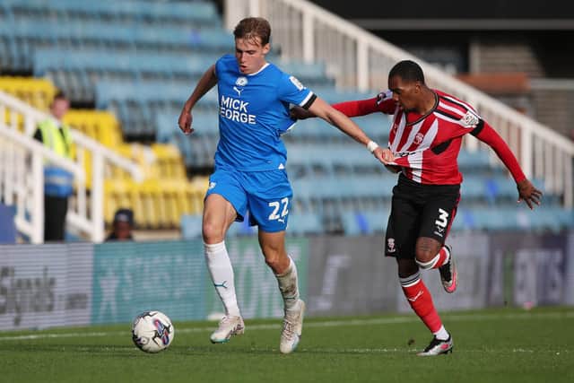 Hector Kyprianou of Peterborough United battles with Jaden Brown of Lincoln City. Photo: Joe Dent/theposh.com
