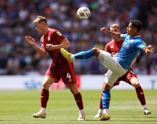 Owen Moxon (left) in action in the League Two play-off final against Stockport County. (Photo by Paul Harding/Getty Images)