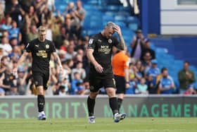Posh striker Jack Marriott cuts a dejected figure after Portsmouth score the winning goal. Photo: Joe Dent/theposh.com
