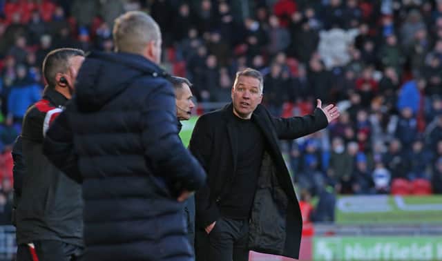 Posh boss Darren Ferguson argues with Doncaster Rovers manager Grant McCann over a controversial decision in 2019. Photo: Joe Dent/theposh.com.