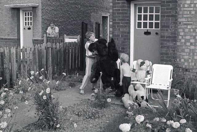 1980 and the cousins in the garden with the teddy bear