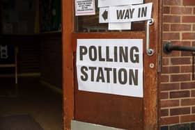 Polling station sign outside the entrance to a political voting location in UK.