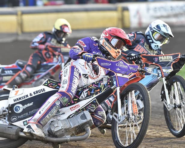 Niels-Kristian Iversen (red helmet) racing for Panthers against Wolves on Monday. Photo: David Lowndes.