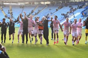 Posh players and manager Robbie Savage celebrate the win at Leicester City. Photo David Lowndes.