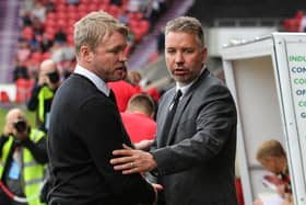 Peterborough United Manager Grant McCann shakes hands with Doncaster Rovers manager Darren Ferguson.