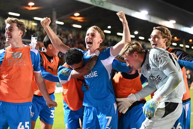 Harrison Jones celebrates scoring the winning penalty for Peterborough United. Photo: David Lowndes.