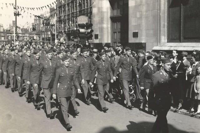 Members of the United States Air Force's Eighth 457th Bomb Group marching on Bridge Street as part of the VE Day celebrations in May 1945.