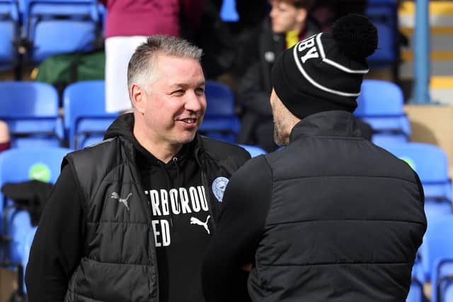Peterborough United Manager Darren Ferguson shares a joke with Derby County Manager Paul Warne before the match. Photo: Joe Dent/theposh.com.