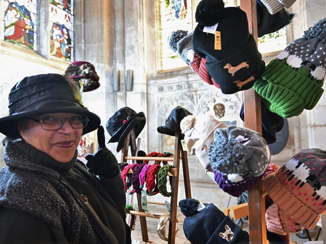 Sophia Wright selling hats at Peterborough Cathedral Christmas market.