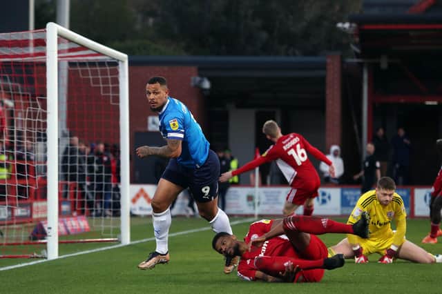 Jonson Clarke-Harris of Peterborough United scores the opening goal of the game against Accrington Stanley. Photo: Joe Dent/theposh.com.