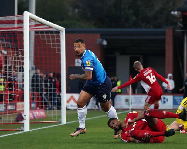 Jonson Clarke-Harris of Peterborough United scores the opening goal of the game against Accrington Stanley. Photo: Joe Dent/theposh.com.