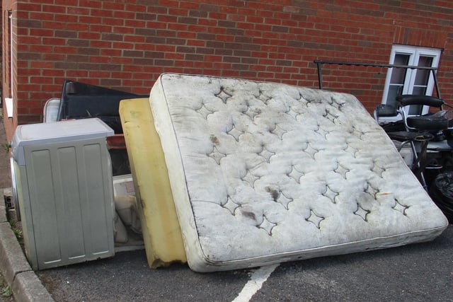 A mattress and other household items left in the West Street car park