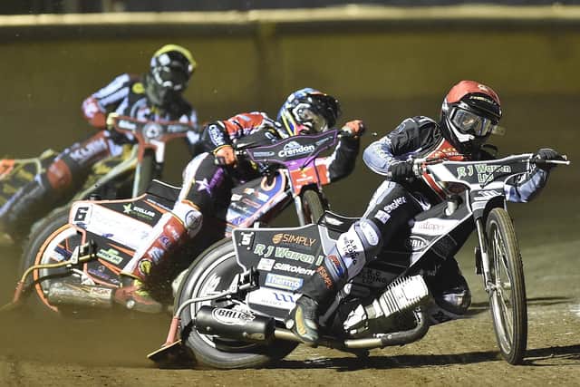 Danny King (red helmet) and Scott Nicholls (blue) lead the way for Panthers against Belle Vue in the final Premiership meeting of the season. Photo: David Lowndes.