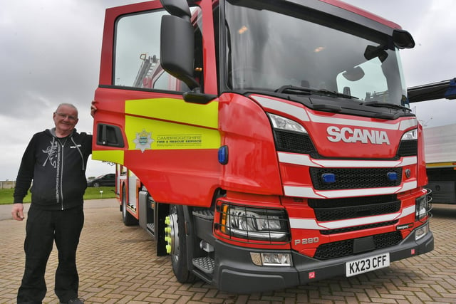 Mike Swift from the Scania UK events team with one of Cambridgeshire Fire's newest appliances on show at the event.
