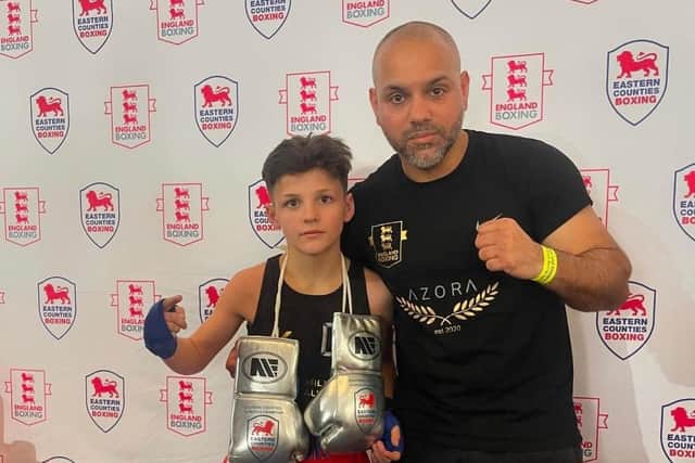 Andra Hoyland with golden gloves and coach Bilal Javed.