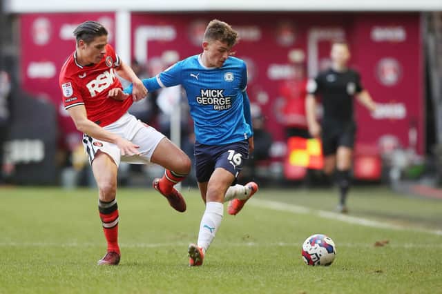 Harrison Burrows of Peterborough United in action with George Dobson of Charlton Athletic. Photo: Joe Dent/theposh.com.