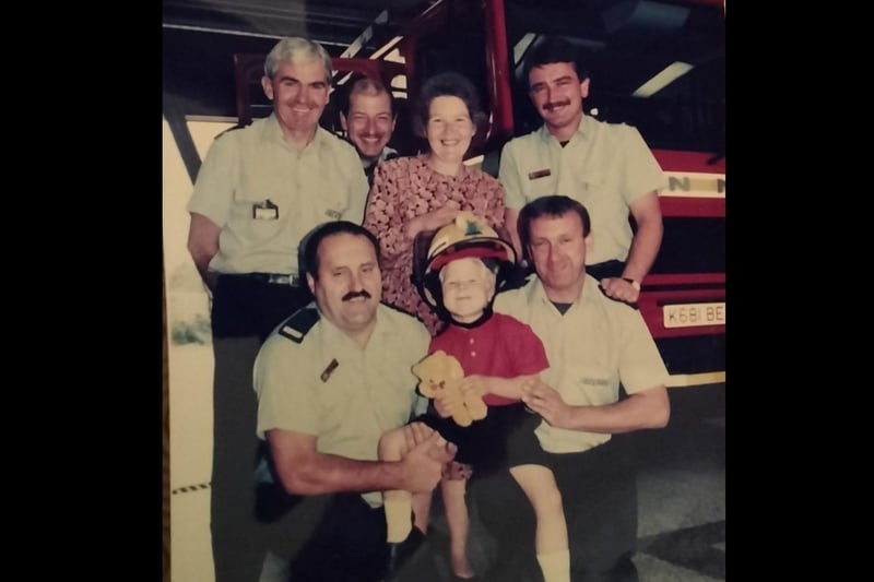 Crews with a child that was delivered as a baby in Stanground Fire Station.