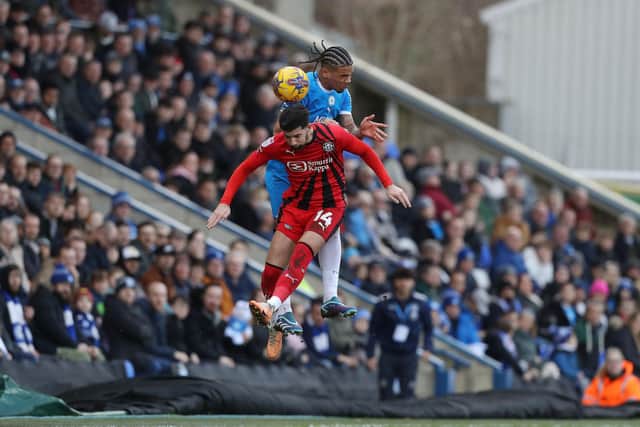 Jadel Katongo of Peterborough United battles in the air with Jordan Jones of Wigan Athletic. Photo: Joe Dent/theposh.com