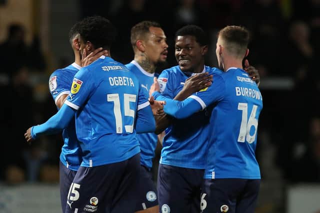 Ephron Mason-Clark (facing) celebrates his goal at Burton. Photo: Joe Dent/theposh.com.