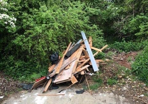 The pile of wood dumped at Peterborough. A man has been fined at court after being caught fly-tipping it in the city